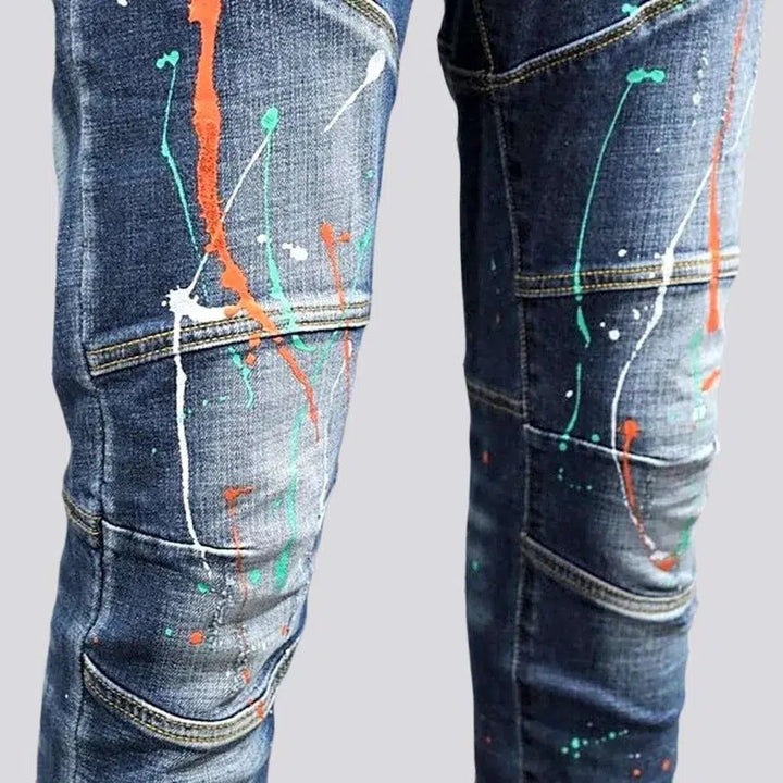 Slightly torn men's moto jeans