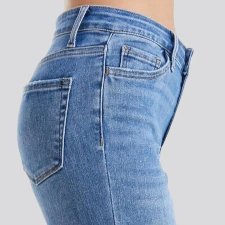 Sanded women's whiskered jeans