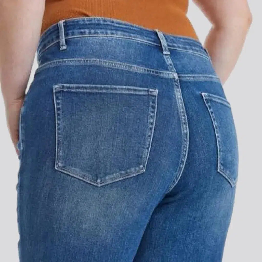 Dark-wash women's ripped jeans