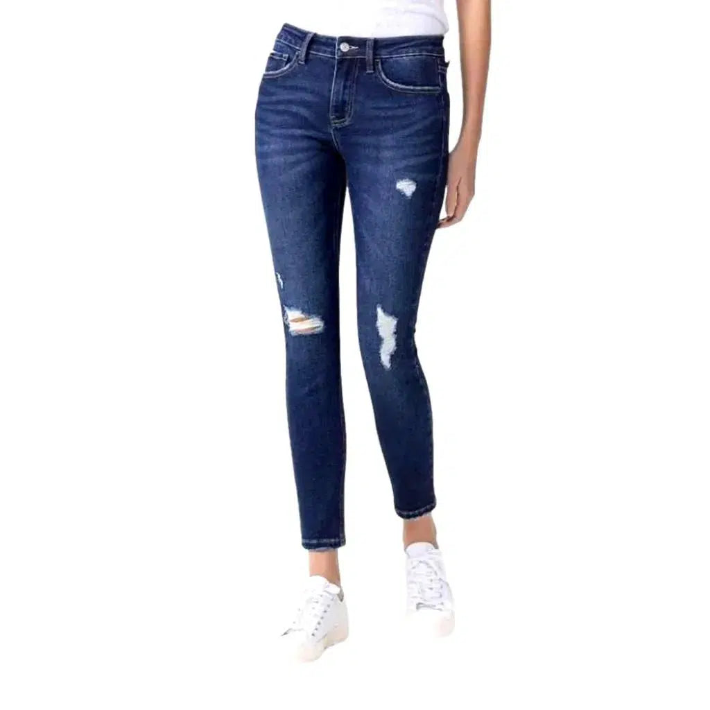 Ankle-length whiskered jeans