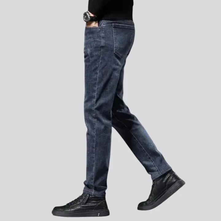 Elastic dark padded jeans for men