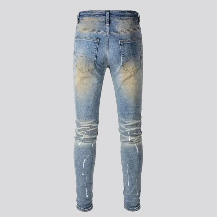 Whiskered crystal-patch jeans