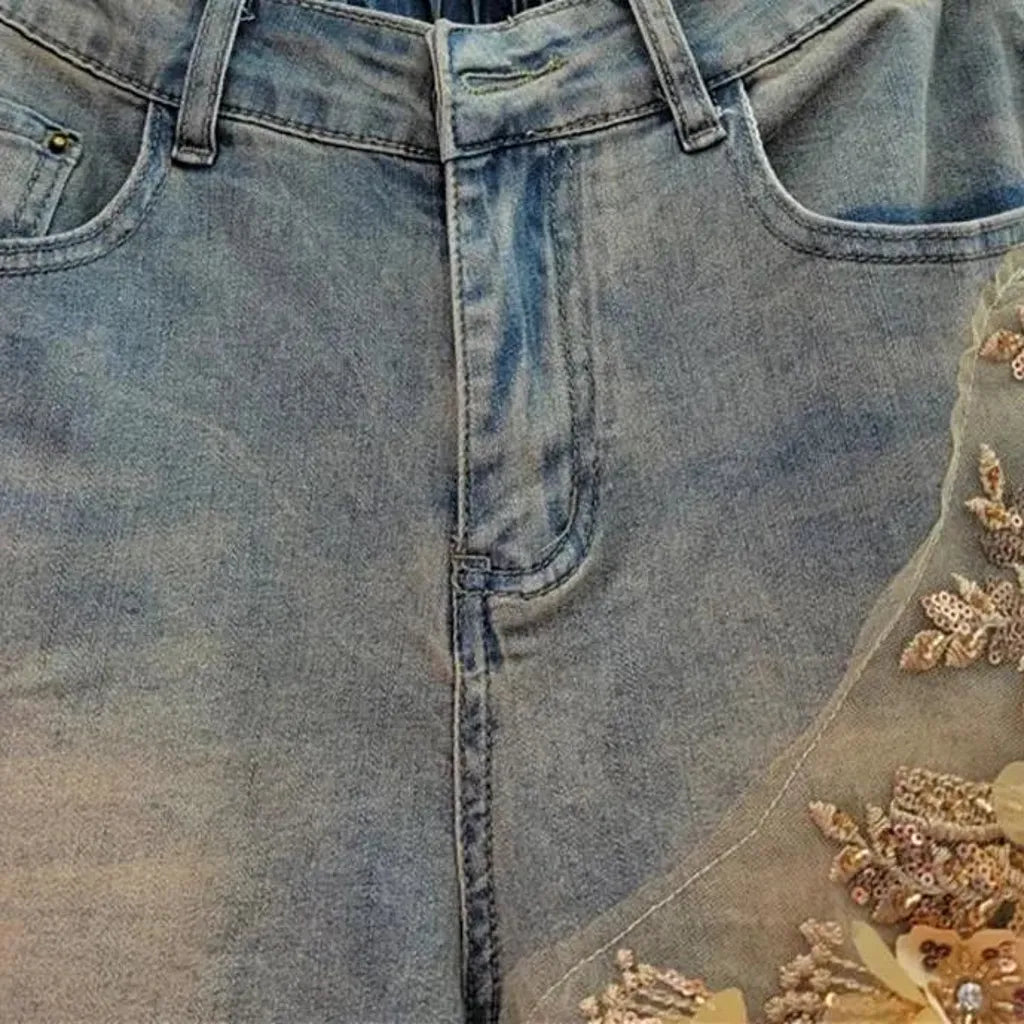 Sanded embroidered women's denim shorts