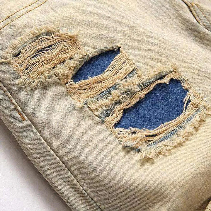 Distressed men's jeans with zippers