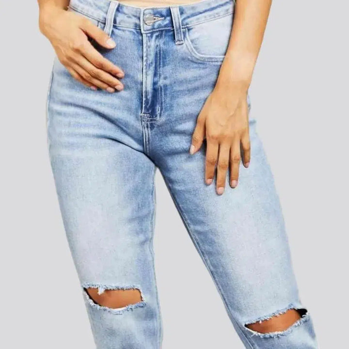 Grunge women's light-wash jeans