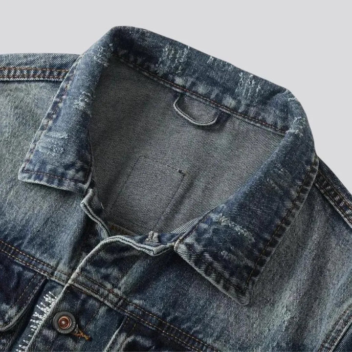 Distressed men's jean jacket