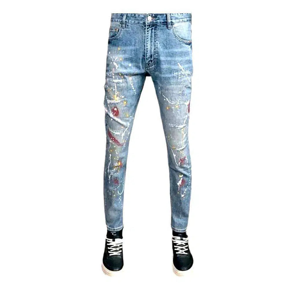 Distressed men's whiskered jeans