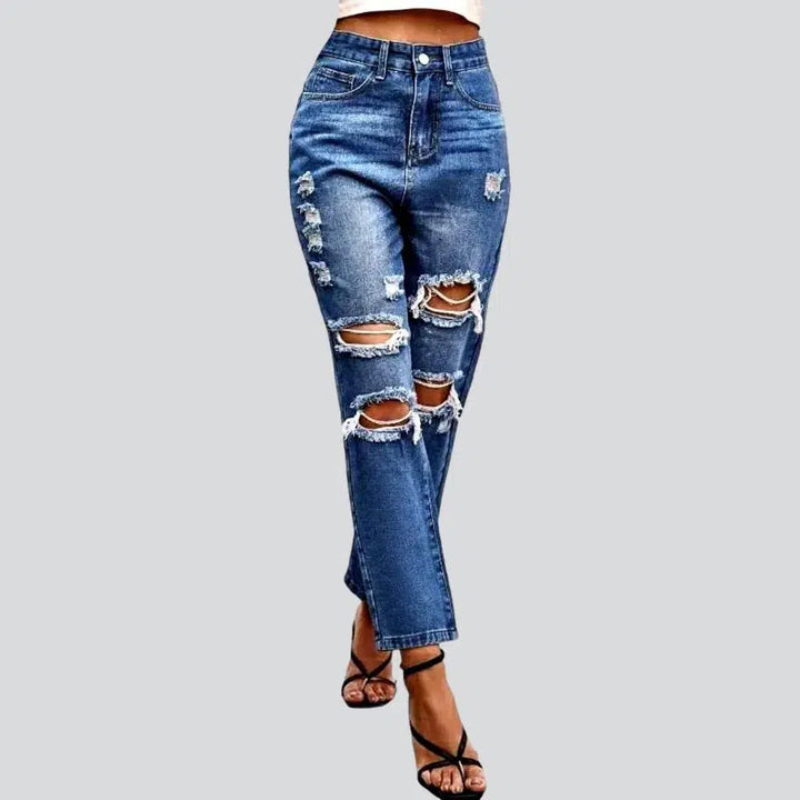 Grunge women's medium-wash jeans