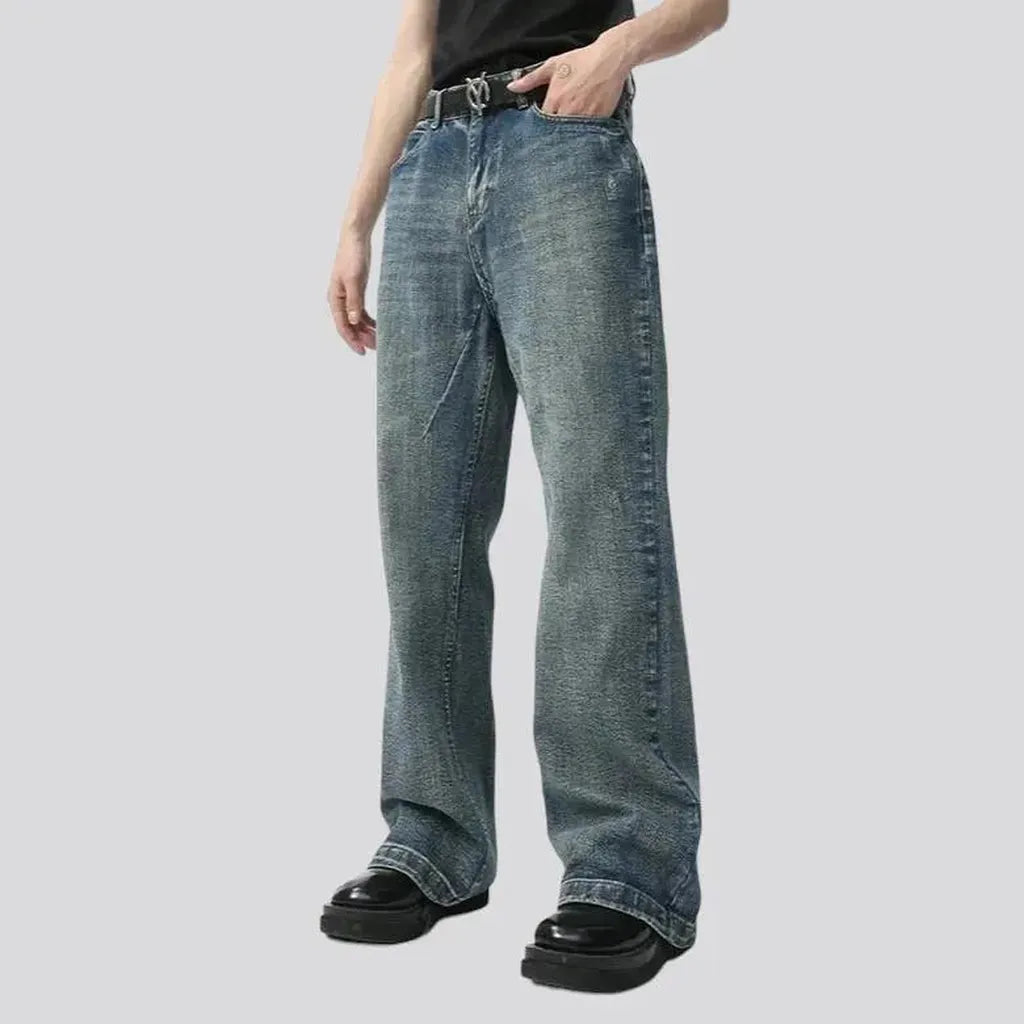 Medium-wash sanded jeans
 for men