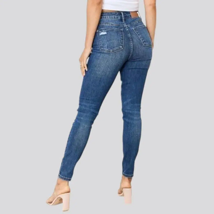 Distressed women's jeans