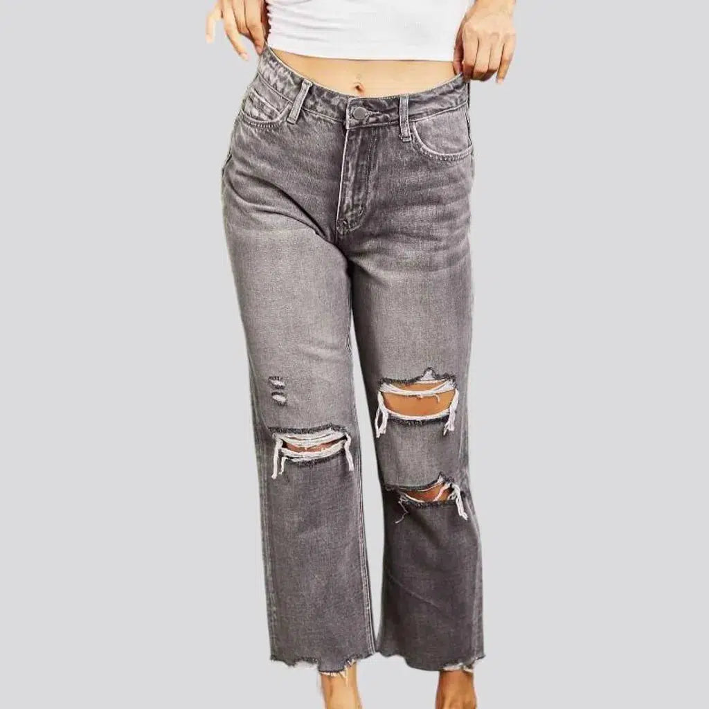 Grunge women's whiskered jeans