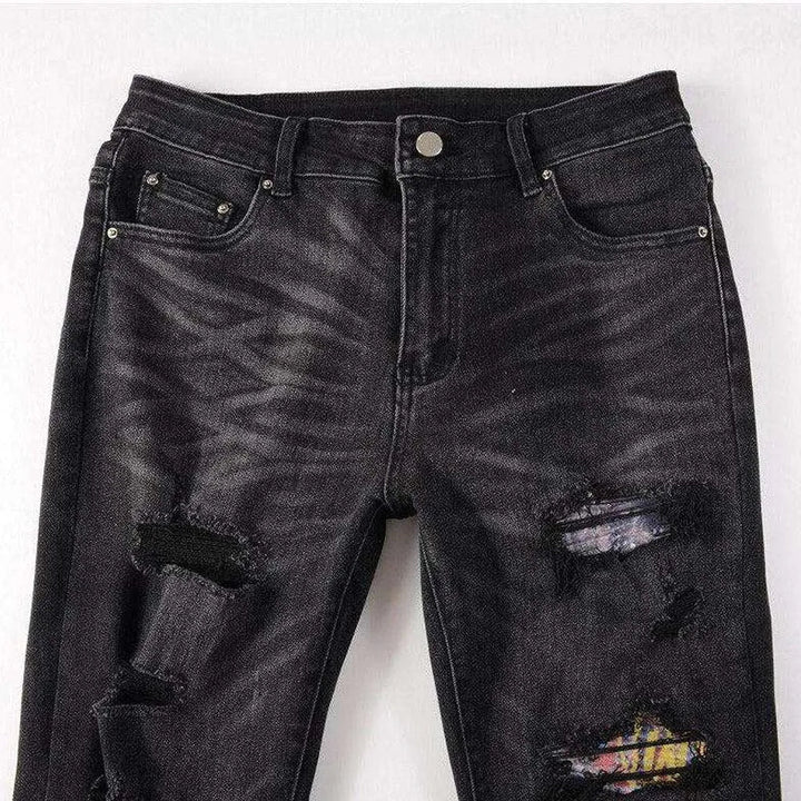Graffiti print patchwork biker jeans
