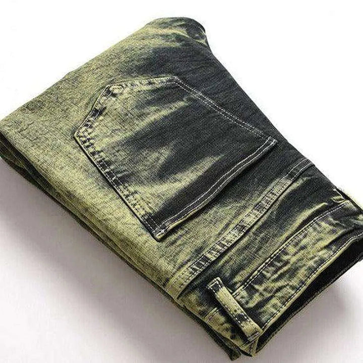 Green over-dyed distressed jeans
