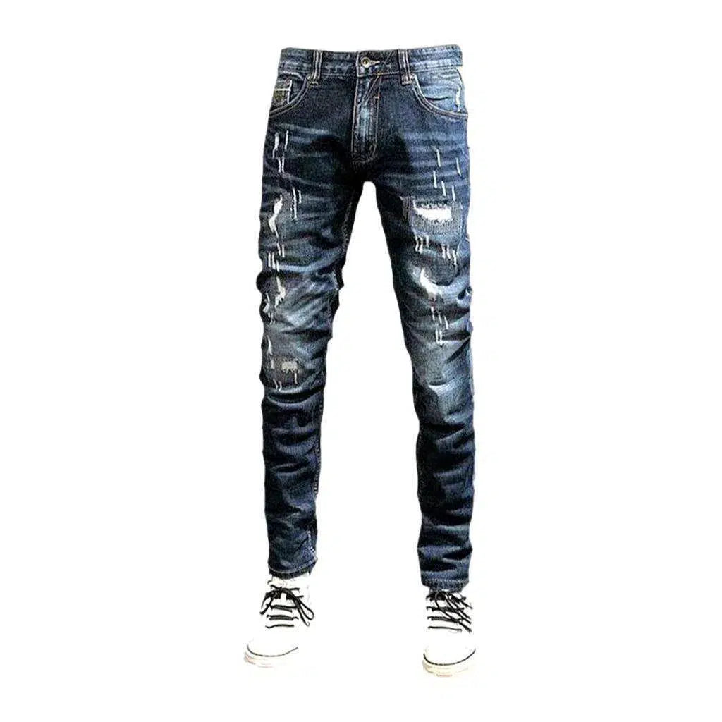 Grunge men's whiskered jeans