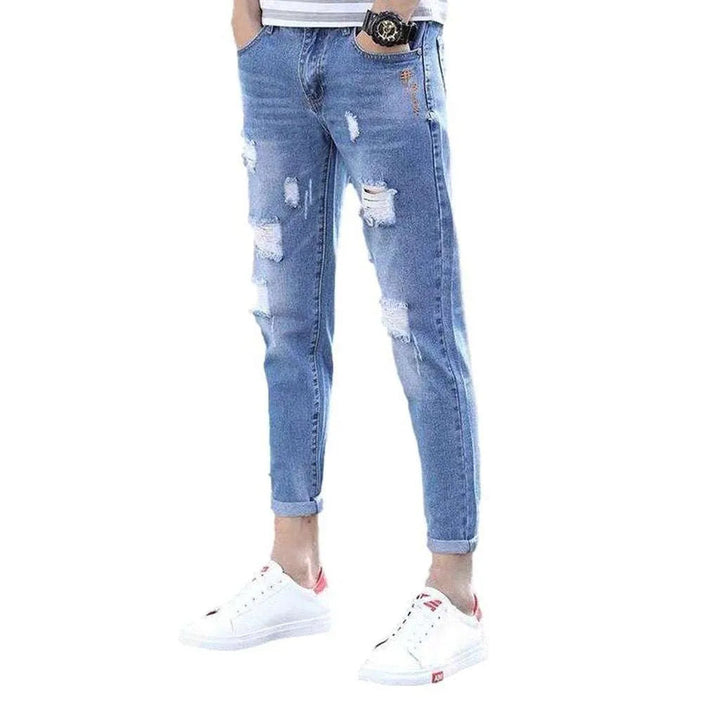 Light wash ripped men's jeans