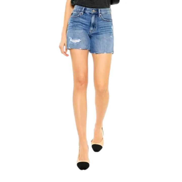 Medium-wash whiskered jeans shorts for women