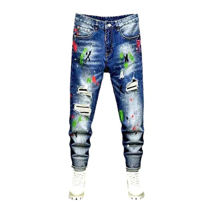 Paint-splattered medium wash jeans