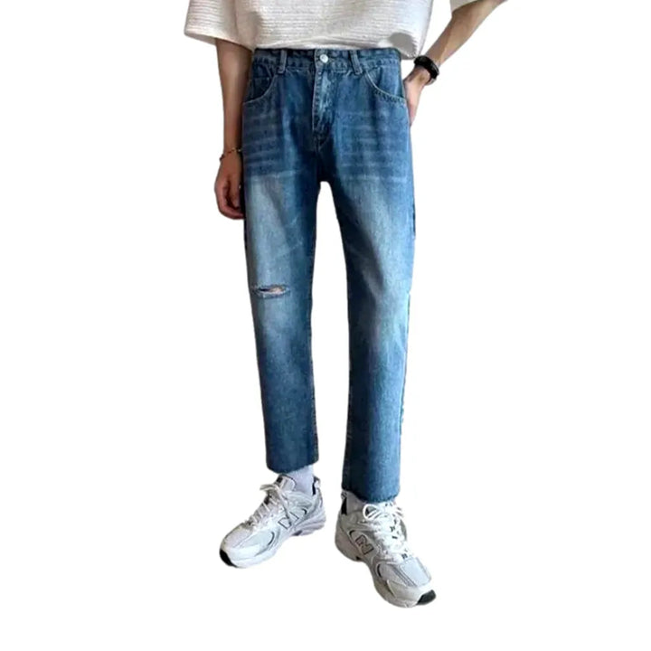 Ripped men's sanded jeans