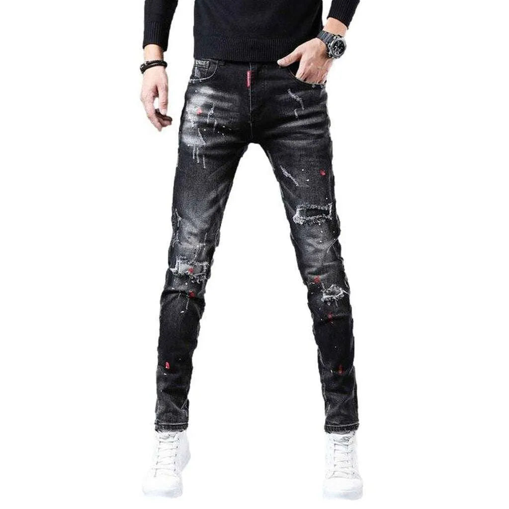 Ripped slightly painted men's jeans