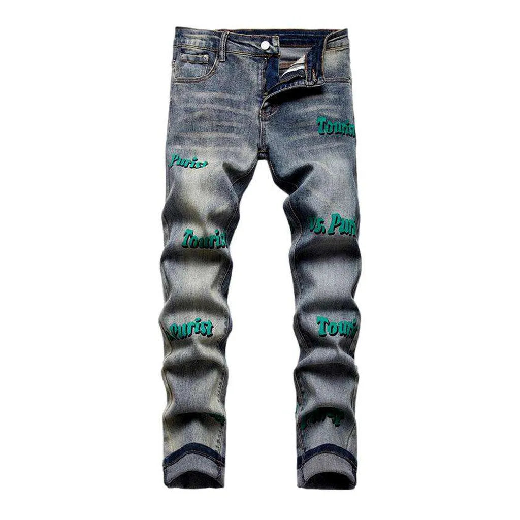Vintage jeans with green inscriptions