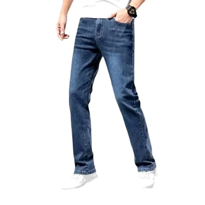Whiskered men's mid-waist jeans