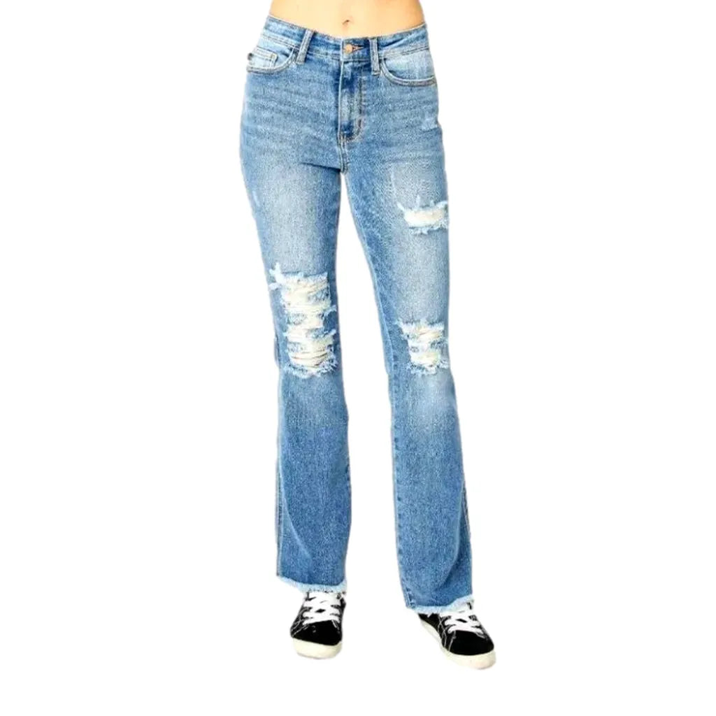 Whiskered women's distressed jeans